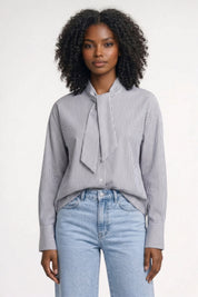 Elegante gestreepte damesblouse met volant en lange mouwen
