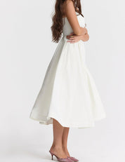 Elegante Midi Jurk met Bandjes en Uitlopende Rok