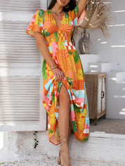 Oranje Bloemenprint Maxi Jurk | Gesmockte Taille | Tropische Zomerjurk Dames